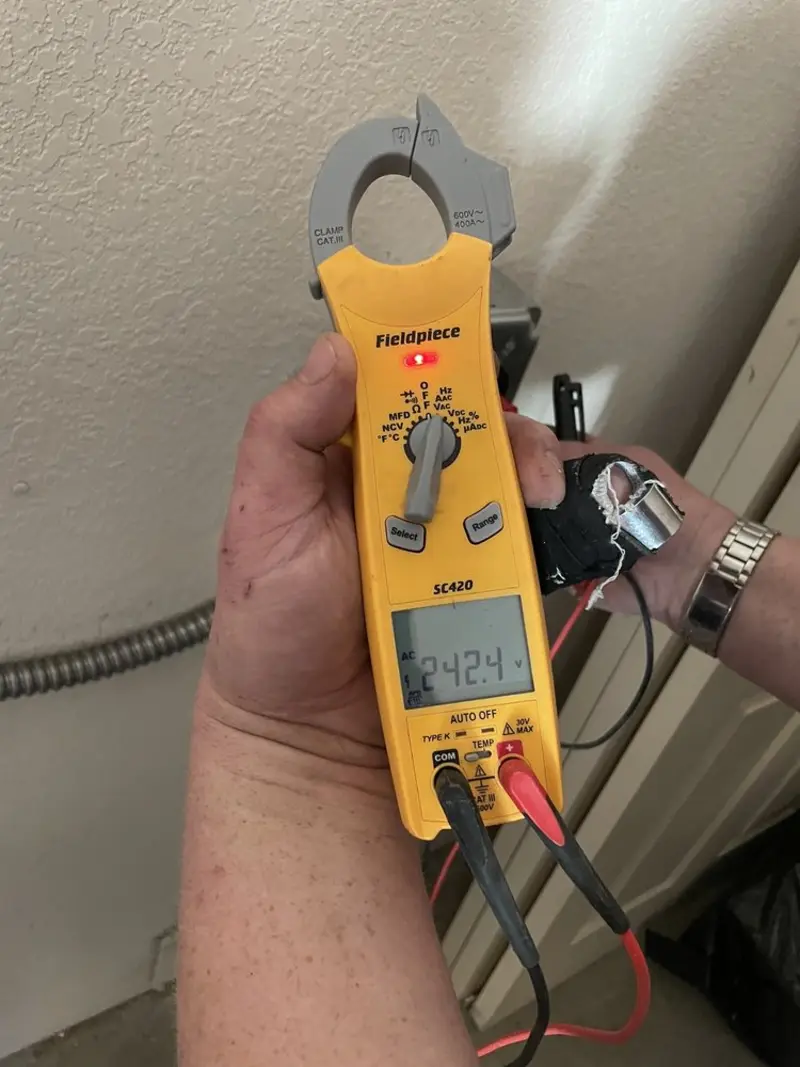 Voltage testing with clamp meter during Ceiling Fan Installation in South Haven